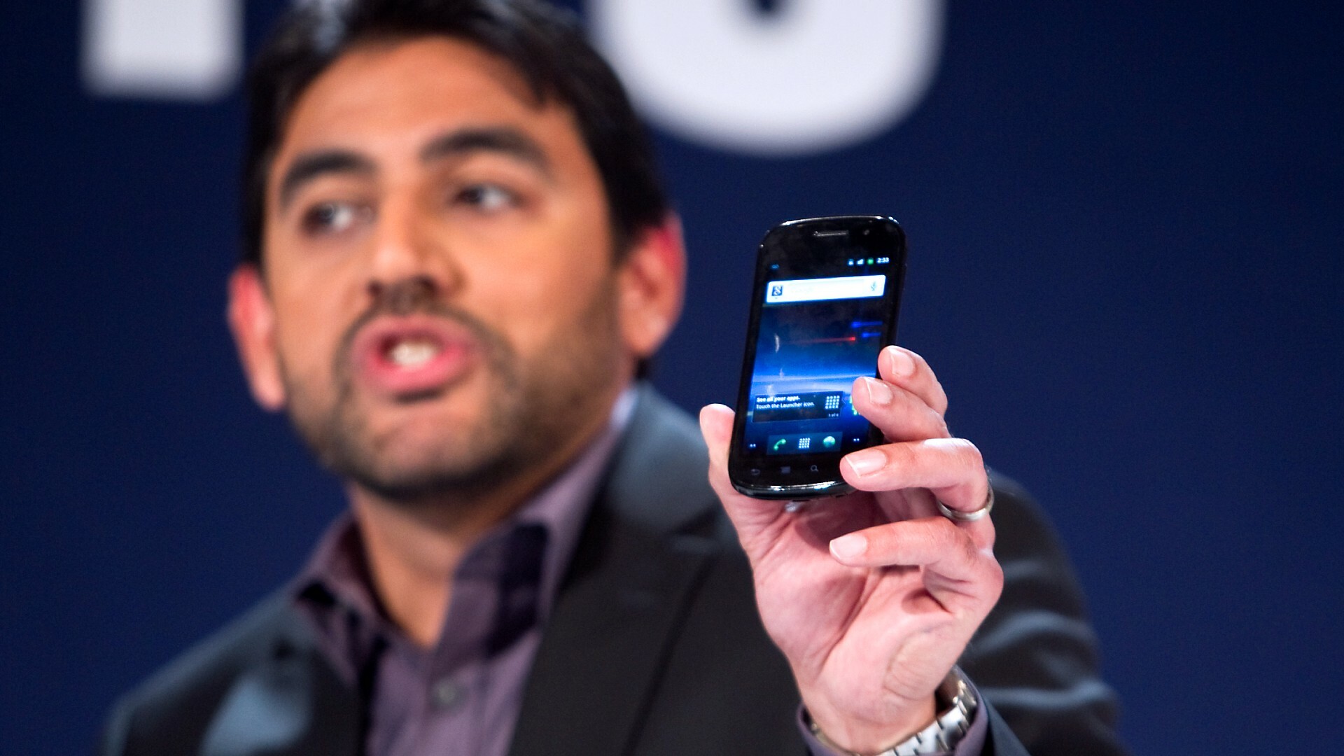 Still using one of these babies? You'll have a problem after September. (Pictured is Omar Khan holding a Samsung Nexus S device in 2011).