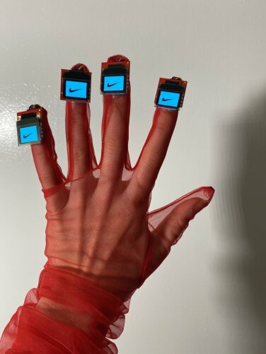 Nail art by McDonald featuring digital screens.