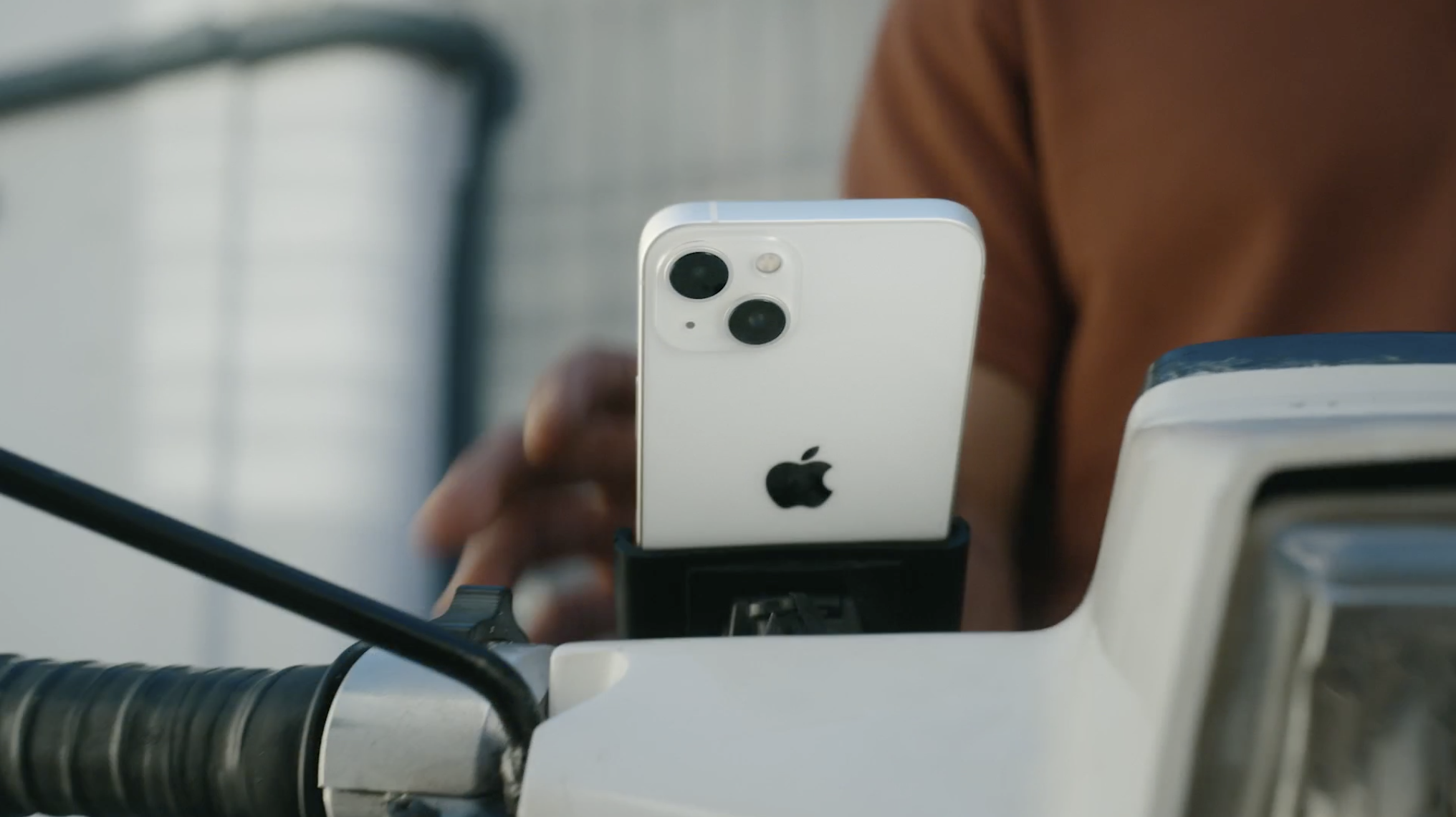 A clip from Apple's iPhone 13 video package showing an iPhone mounted to a motorcycle.