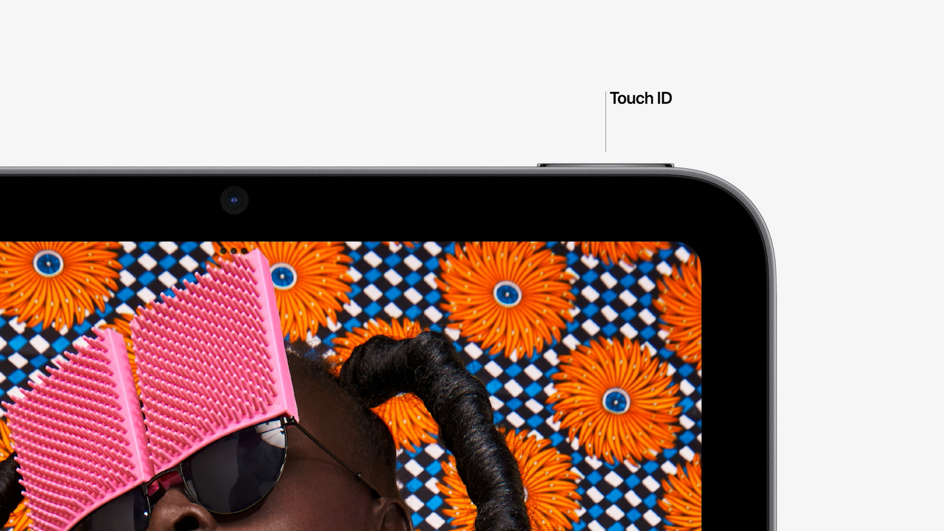 The iPad mini has Touch ID on the upper right.