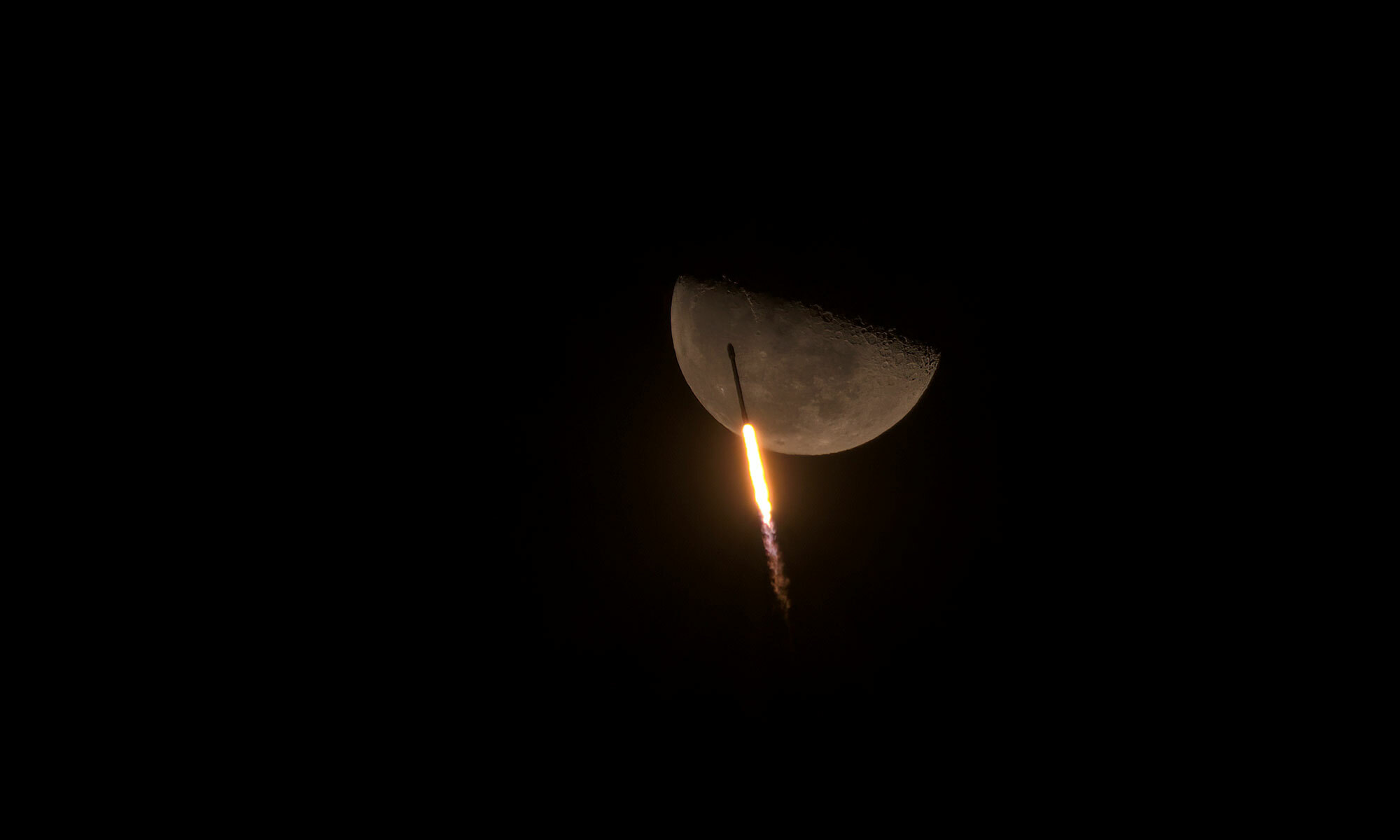 "Falcon 9 Soars Past the Moon" by Paul Eckhardt (winner).