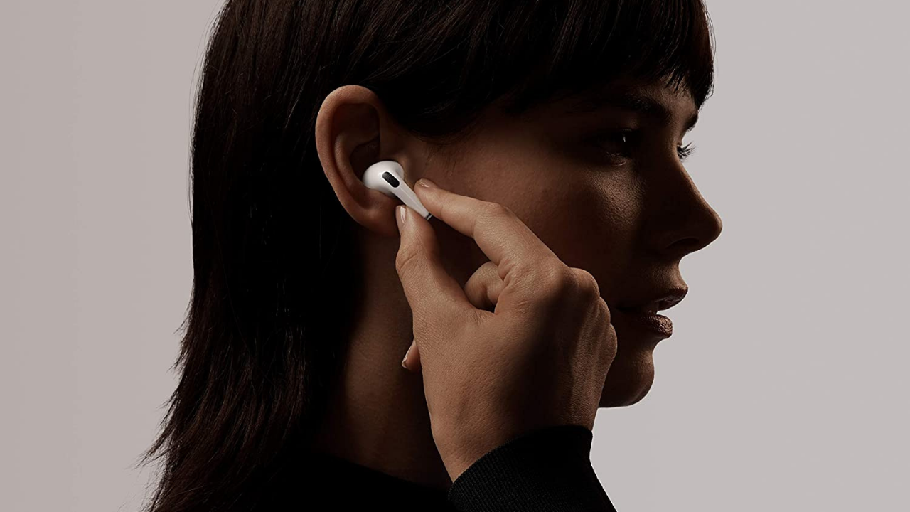 woman putting AirPods Pro in her ears