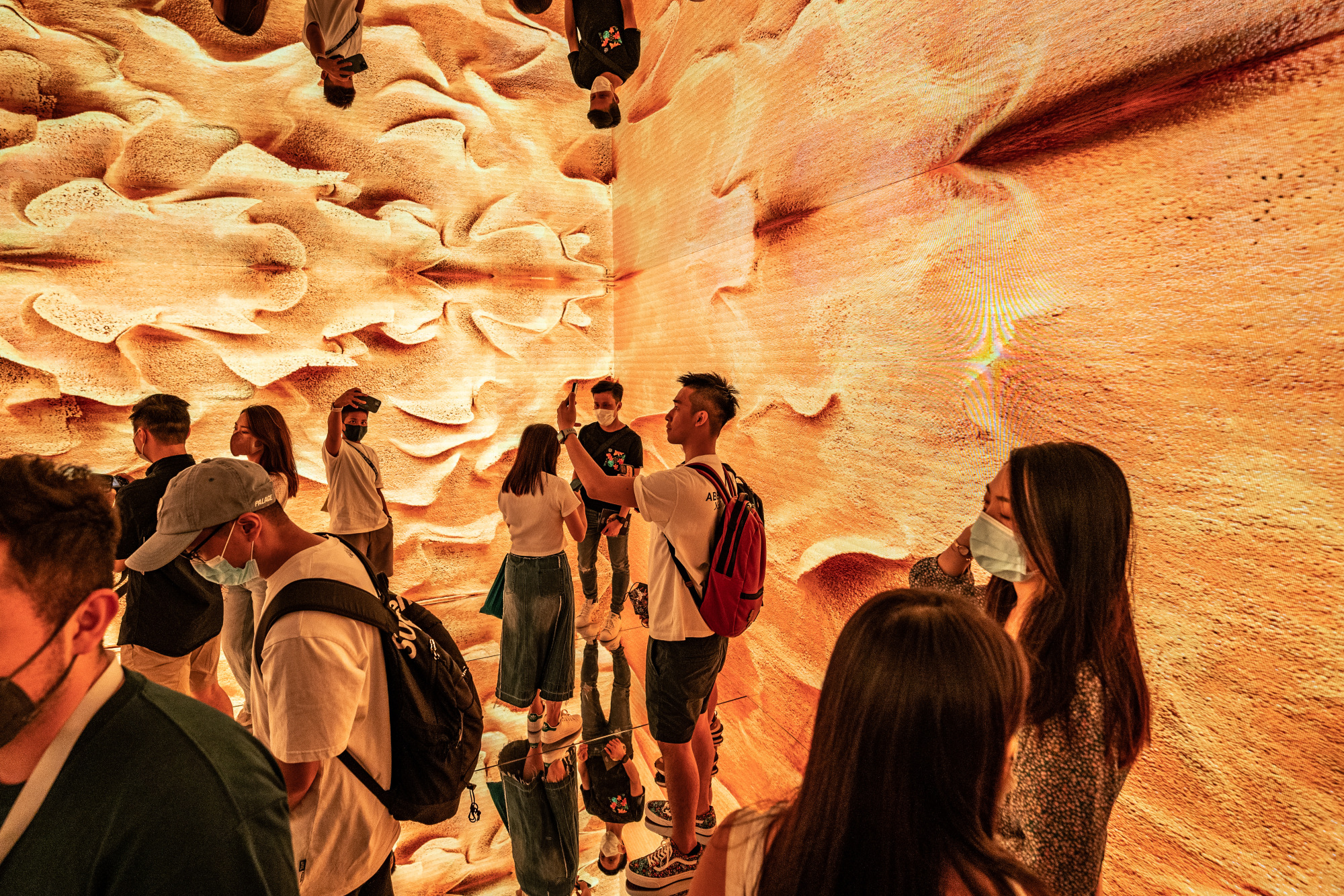 Visitors wander through Anadol's installation.