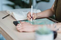 woman drawing on a tablet