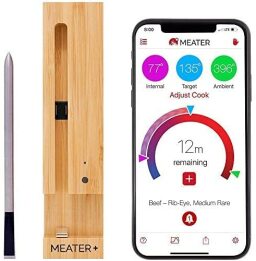 silver meat thermometer, bamboo charging dock, phone screen with temperature and cook time