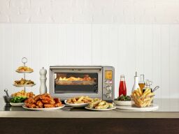 Breville smart oven air fryer surrounded by food