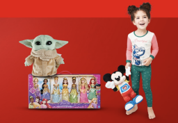 a girl holding a mickey mouse toy next to a yoda doll and a barbie set on a red background