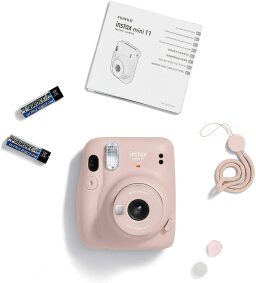 Fujifilm Instax Mini 11 instant camera on a white background.