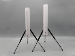 Two white light bars on black stands