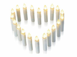 Electric candles arranged in heart shape