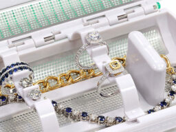 Bracelets and gemstone rings on holder
