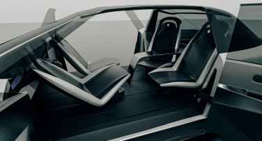A car with doors open and seats facing each other.