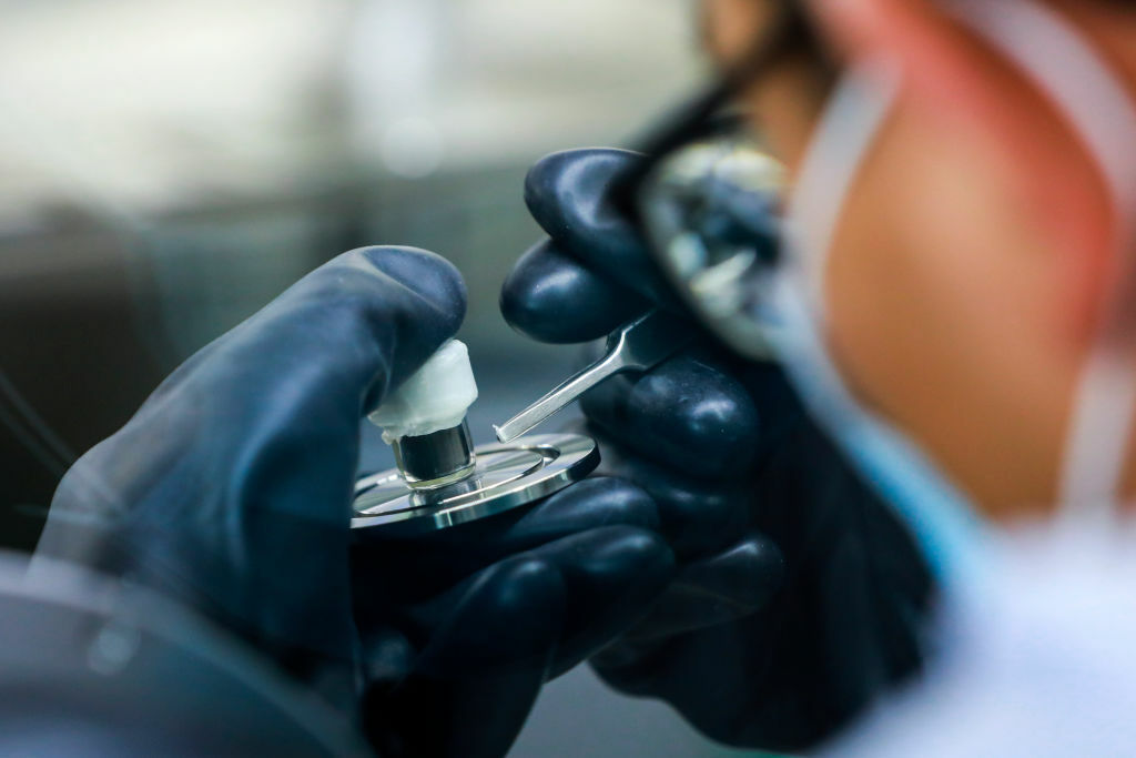 A researcher studying lunar soil 