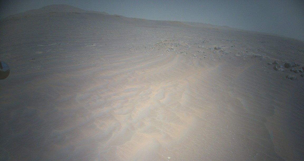 The Mars Ingenuity helicopter captures a view of the Martian terrain.