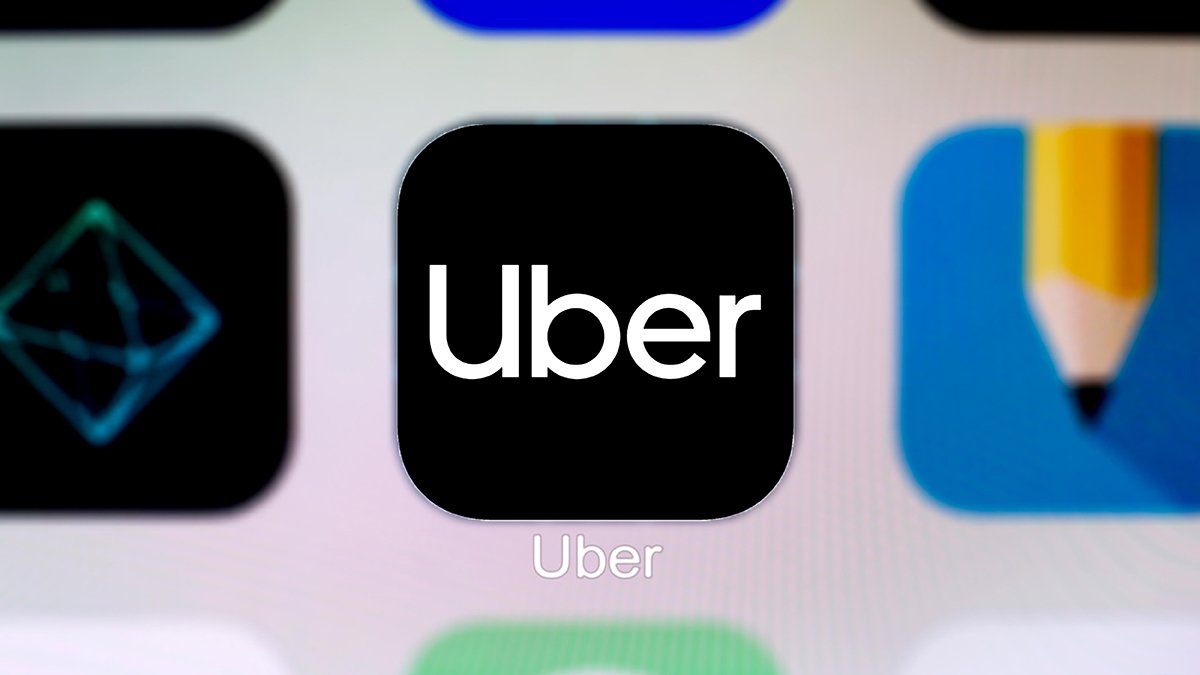 A close-up of an Uber app icon seen displayed on a smartphone screen