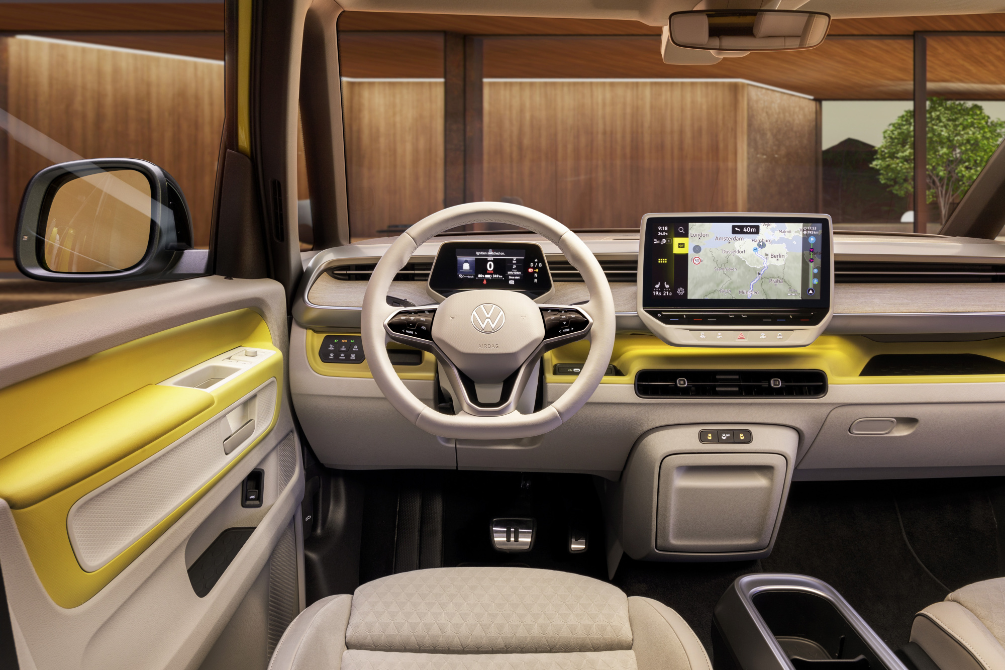 The driver's seat interior of the ID. Buzz shows a steering wheel and center console.
