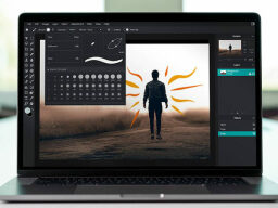 Laptop with screen showing photo editing window