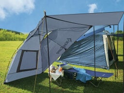 Grey tent over table and stretcher in field