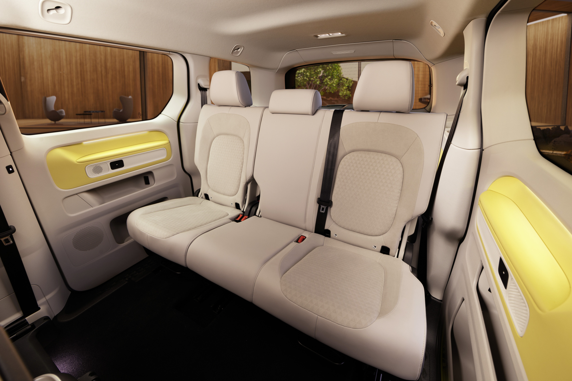 The back row bench of the ID. Buzz features three seats and yellow details.