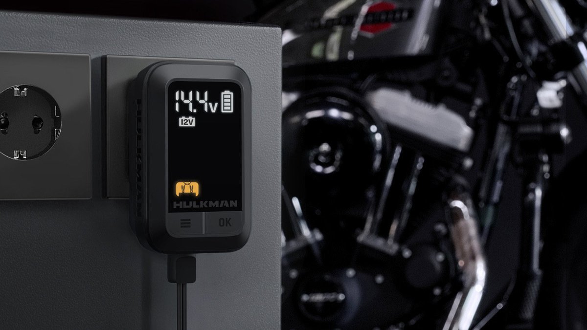 Black charging port plugged into socket and displaying numbers