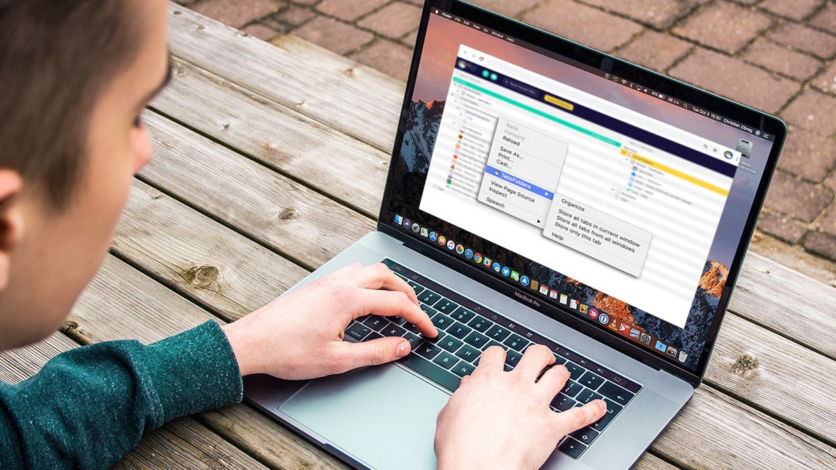 Person looking at laptop on tabfolders window