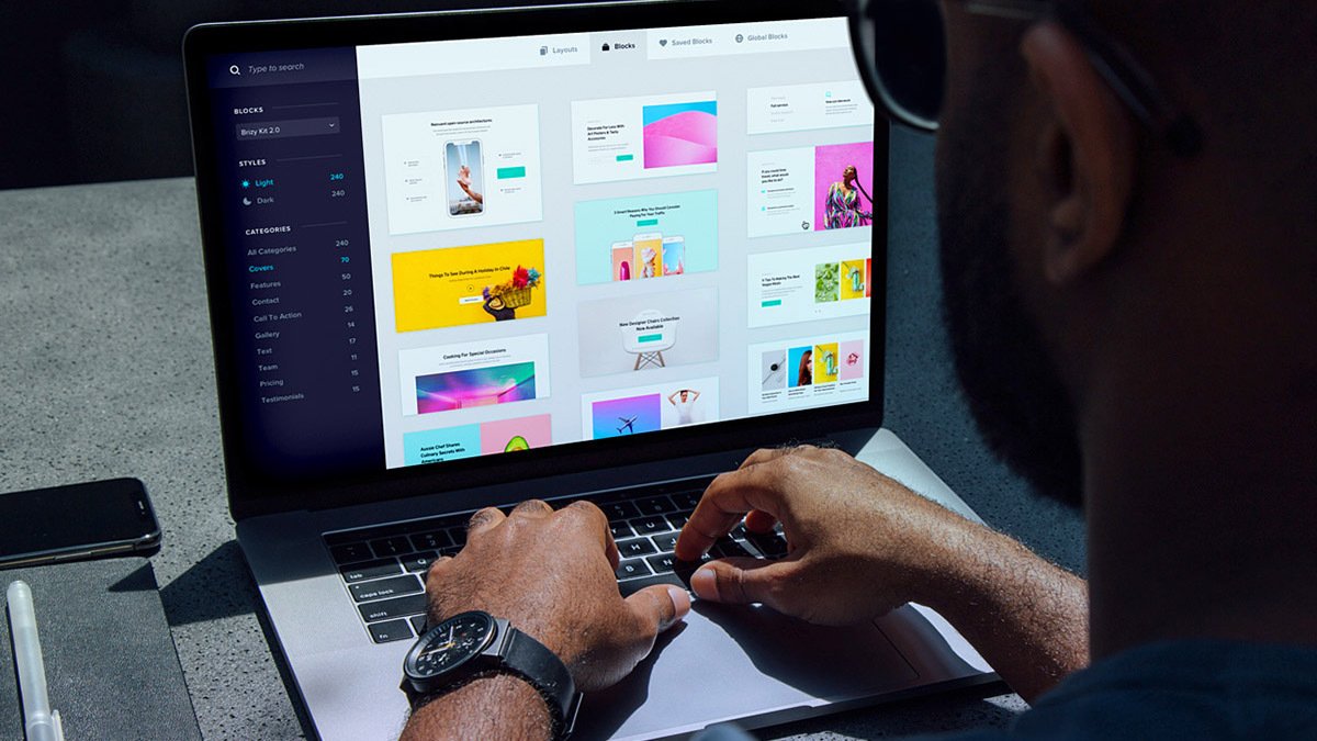 Person with hands on laptop open to brizy website builder page