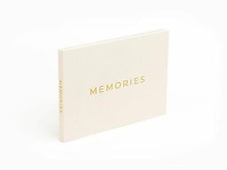Yellow booklet standing up with memories written on front