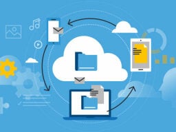 Graphic of cloud with laptop and files revolving around it