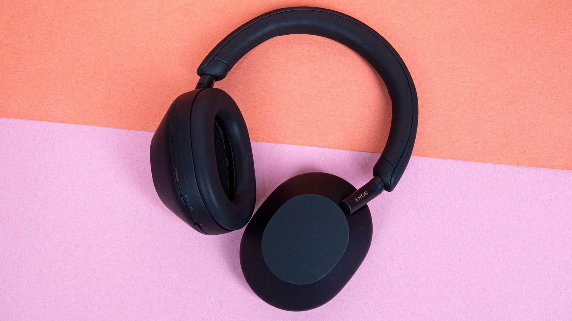 headphones on split color background 