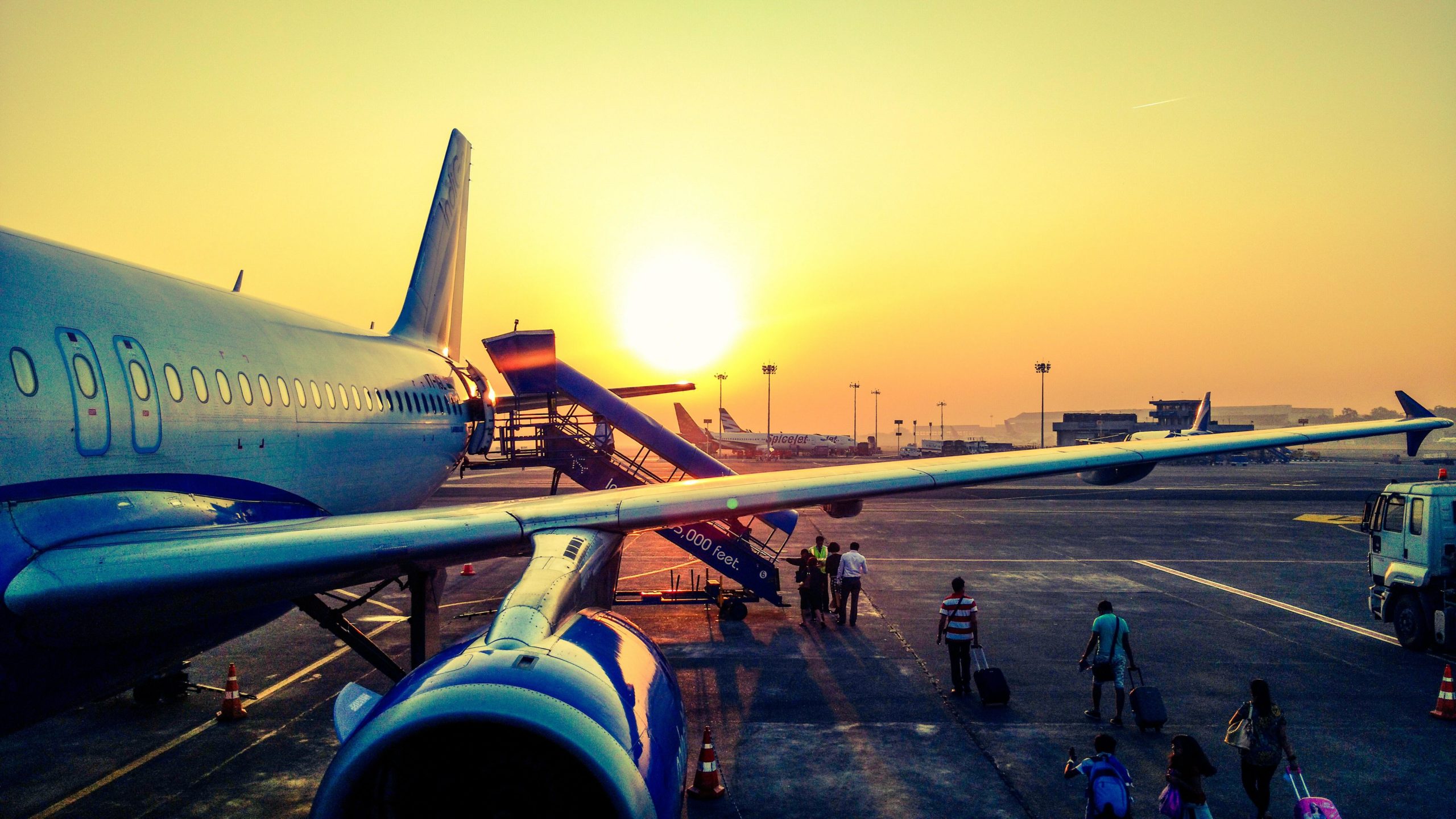 An aeroplane wing at sunset