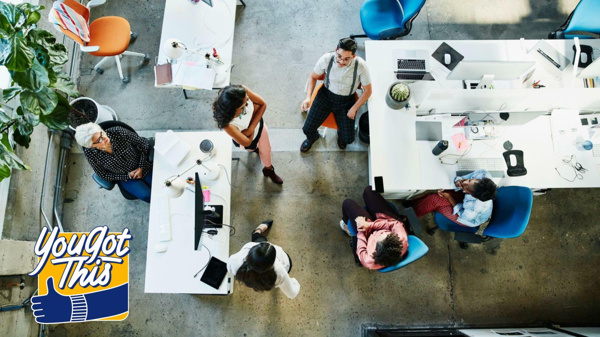 overhead view of a design team having a project meeting in office