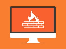 Computer with orange fire on brick graphic