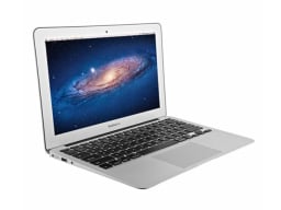 Silver macbook showing image of galaxy