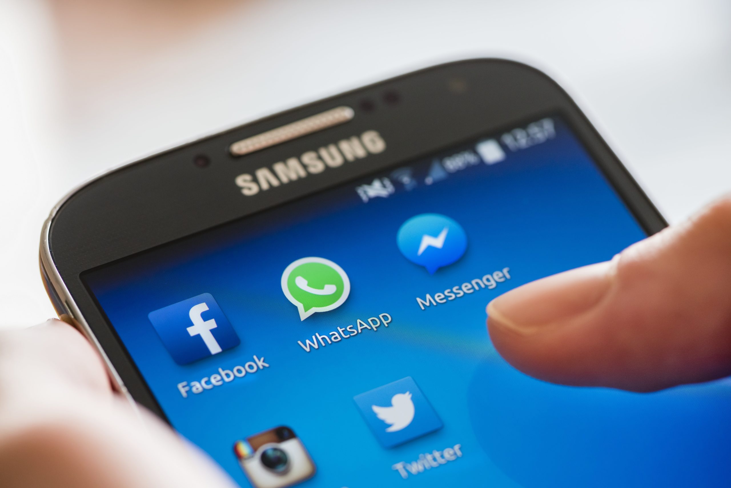 Icon of Facebook, WhatsApp and Messenger (Facebook's proprietary messaging app) alongside other social media apps on a Samsung Galaxy smartphone's touchscreen.