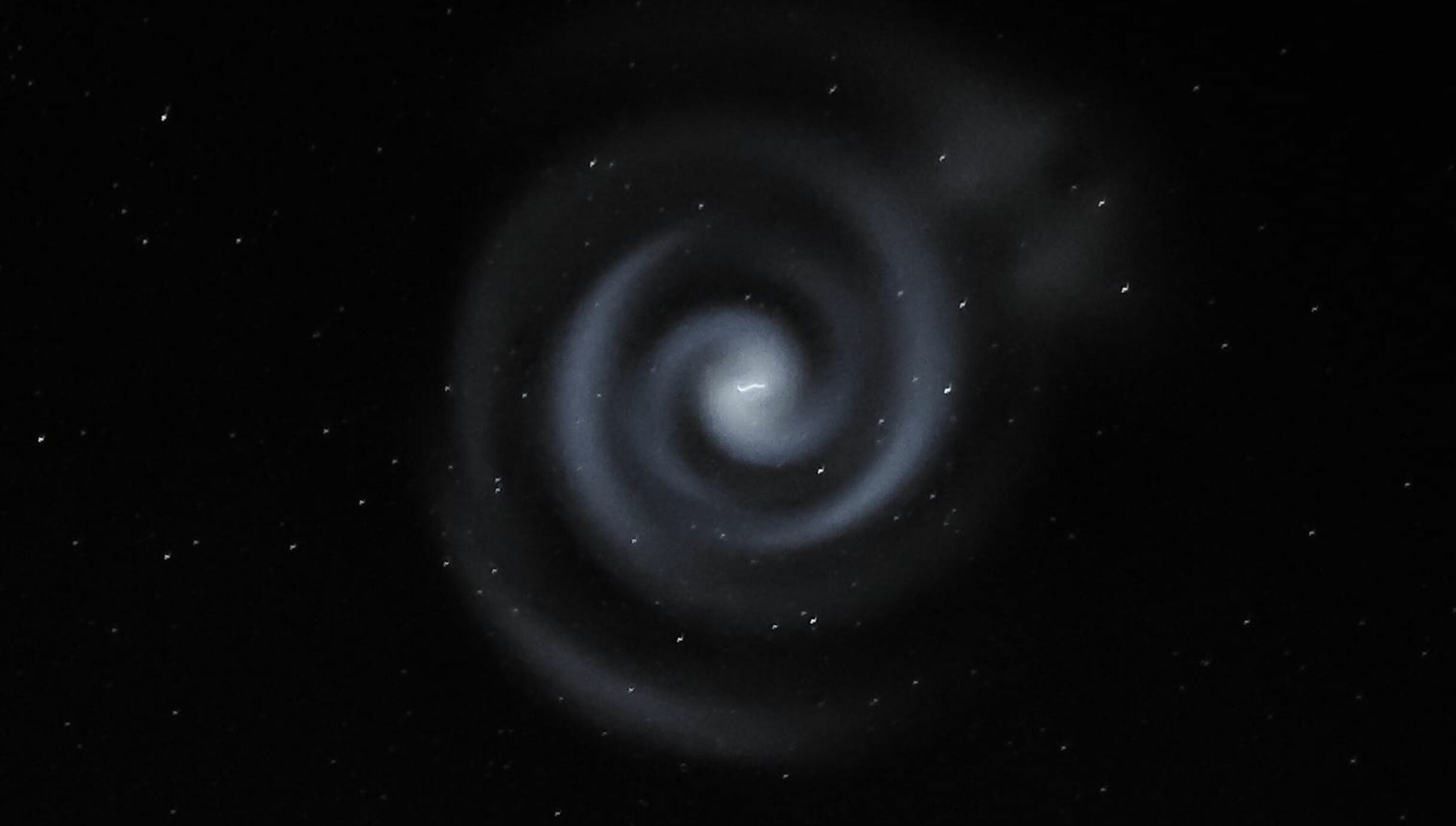 Blue light spiral captured in the night sky