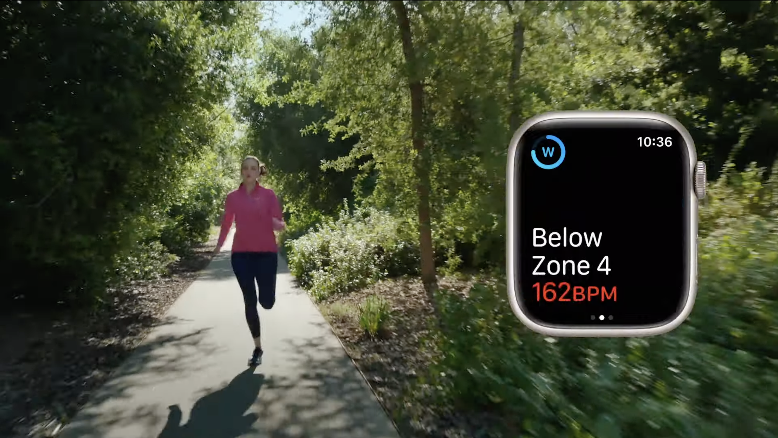 woman running with display of apple watch heart-rate zone