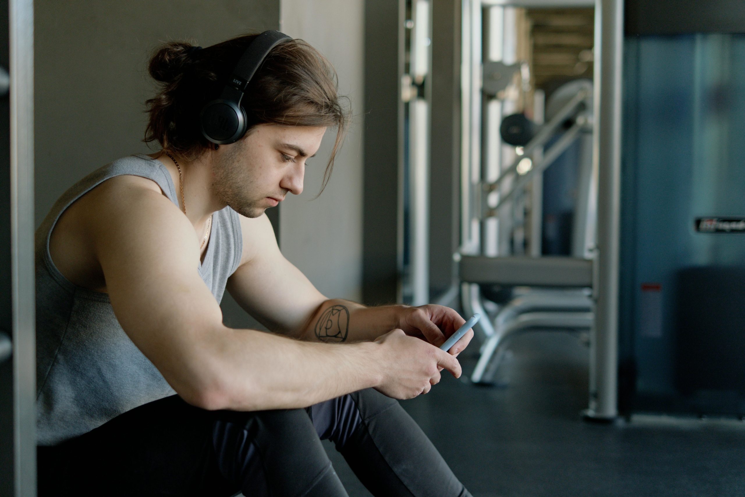 Person wearing headphones at gym