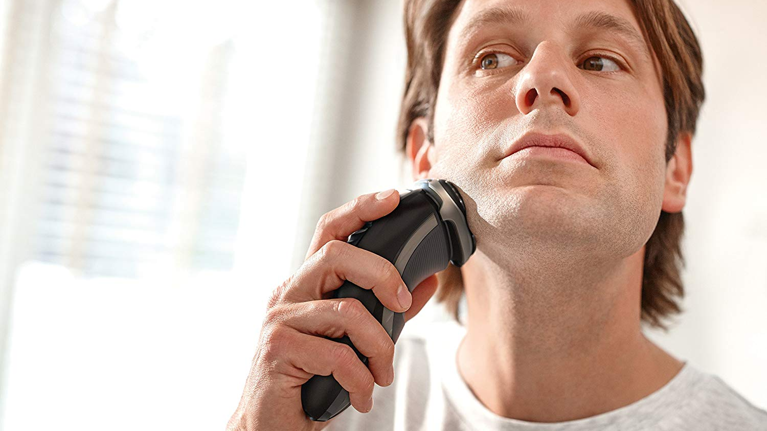 Man shaving with an electric shaver