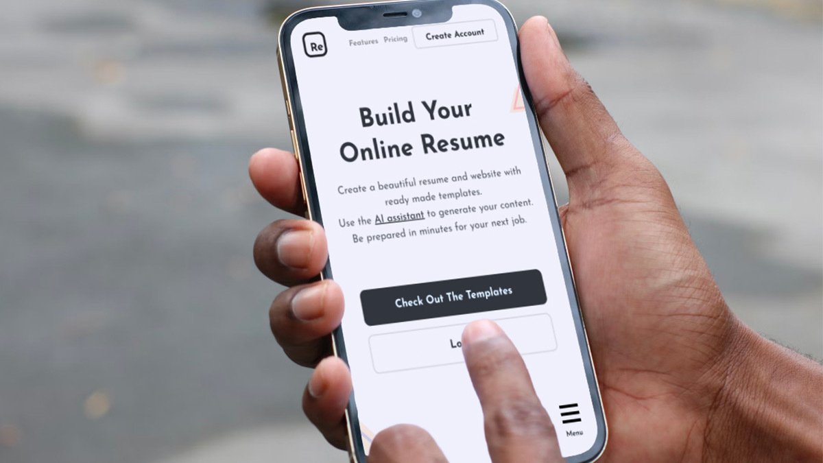 Hand using phone with build your online resume screen