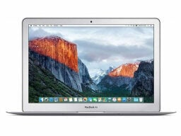 Silver macbook air with mountainous background