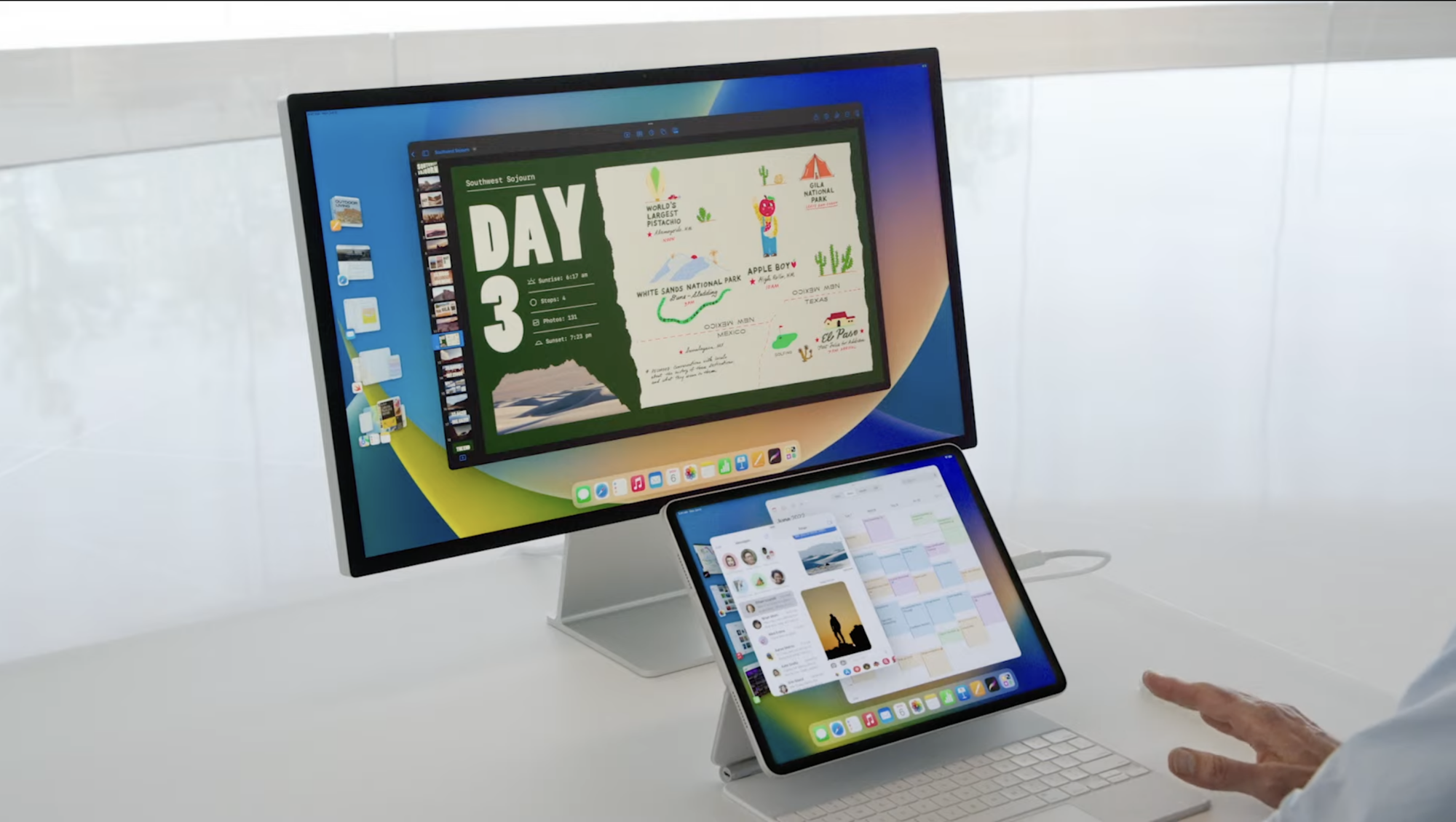 A Mac sits behind an iPad in a demo for iPad OS 16.