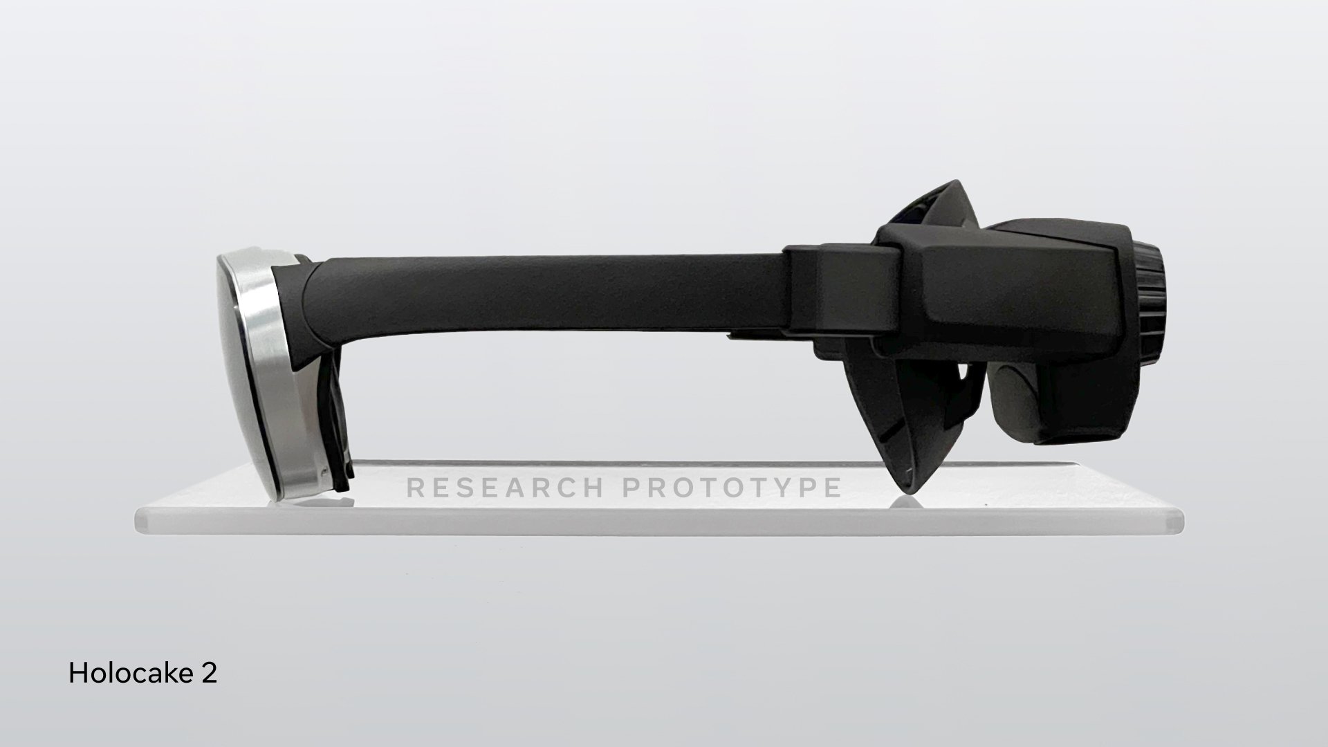 A side profile of Holocake 2, which is black with silver goggle-esque rims.