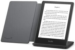 Black kindle with white text on a black charging stand, with open black fabric cover attached