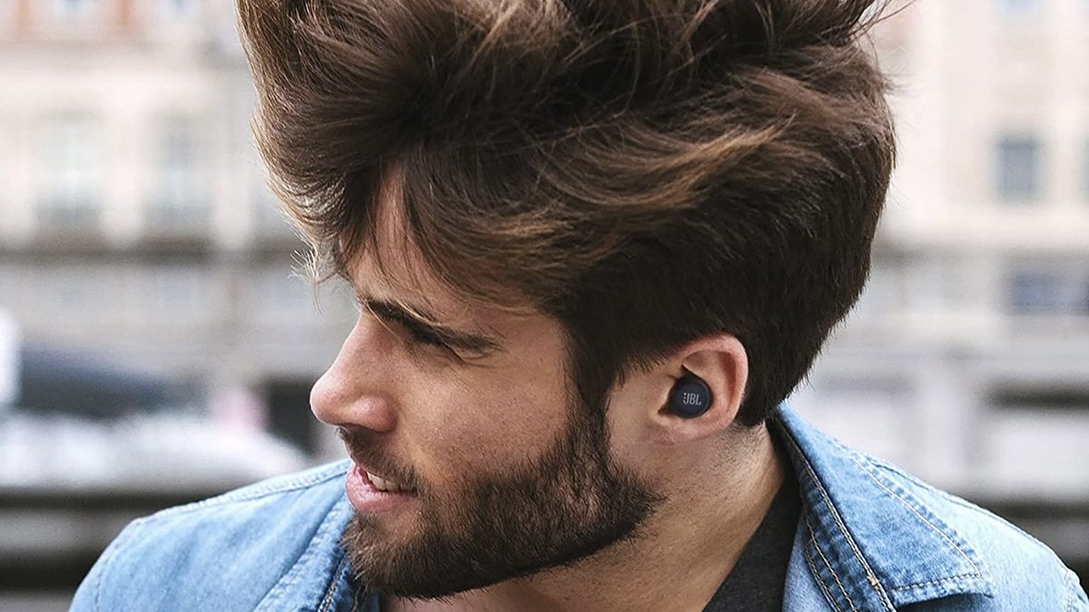 Person wearing JBL Live Free NC+ True Wireless in-Ear Noise Cancelling Bluetooth Headphones.