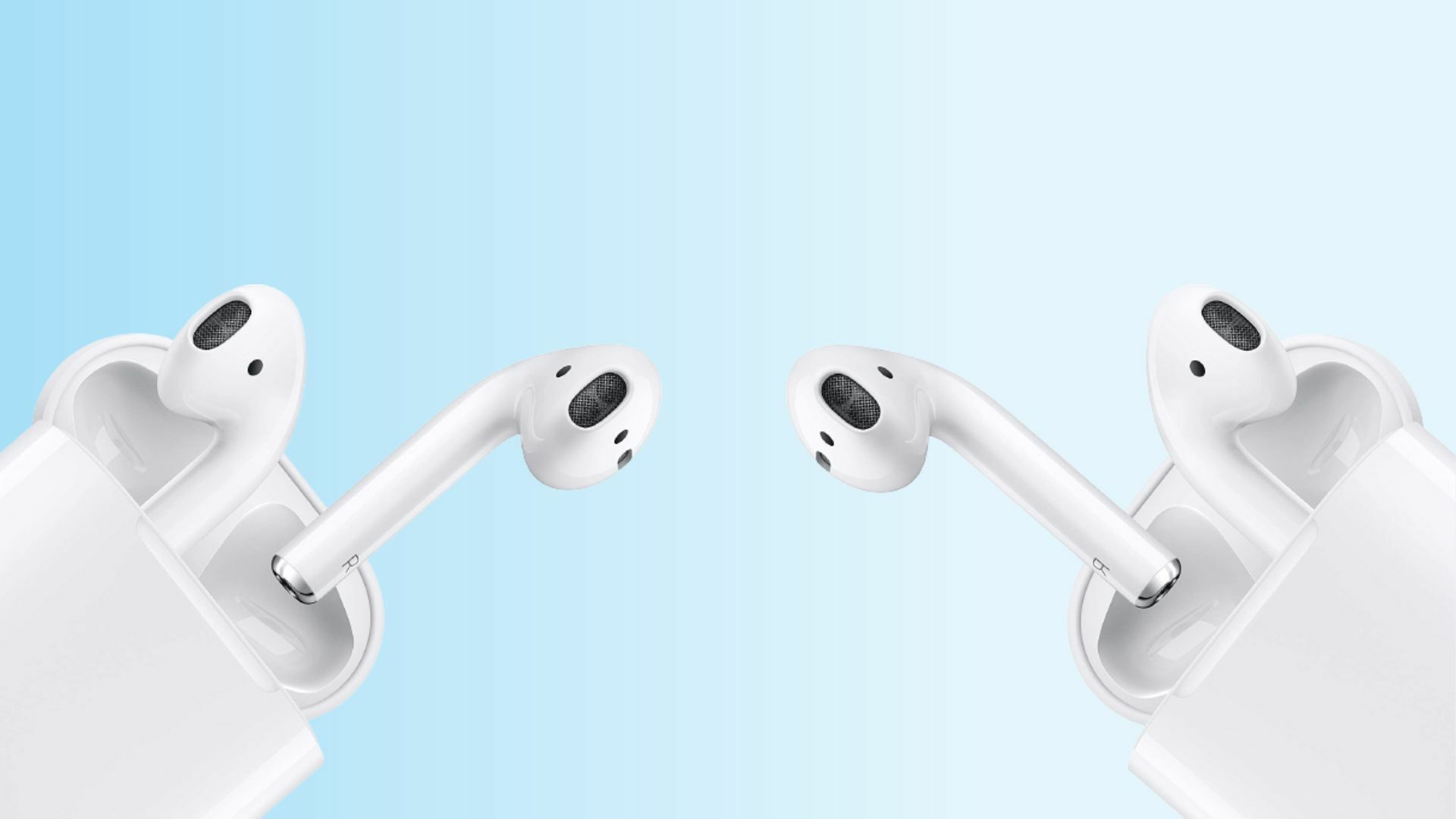 two pairs of airpods in their cases facing each other