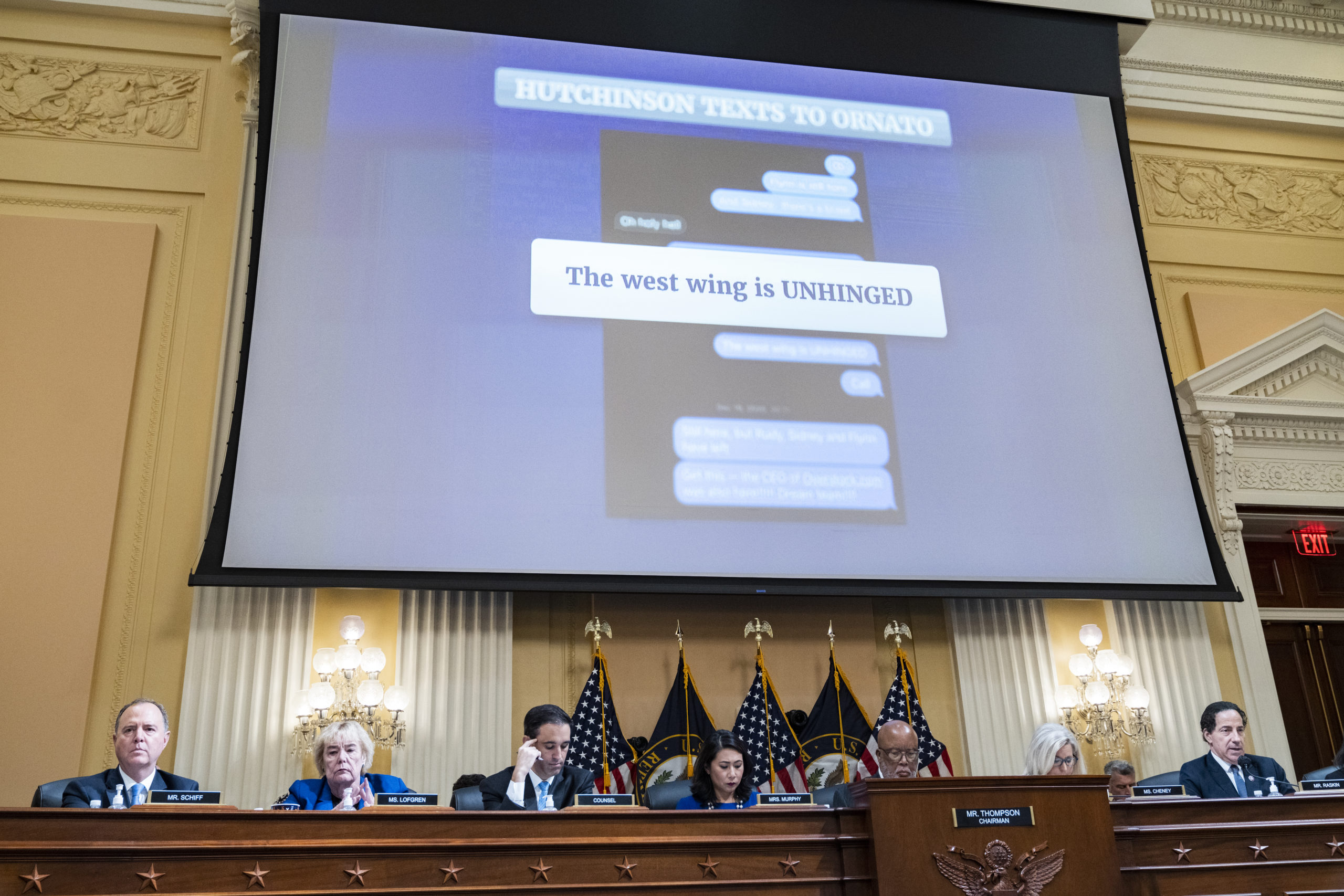 A text message appears on a screen during the Select Committee to Investigate the January 6th Attack on the United States Capitol hearing to present previously unseen material and hear witness testimony in Cannon Building, on Tuesday, July 12, 2022. Appearing from left are, Rep. Adam Schiff, D-Calif., Rep. Zoe Lofgren, D-Calif., counsel, Rep. Stephanie Murphy, D-Fla., Chairman Bennie Thompson, D-Miss., vice chair Rep. Liz Cheney, R-Wyo., and Rep. Jamie Raskin, D-Md. 