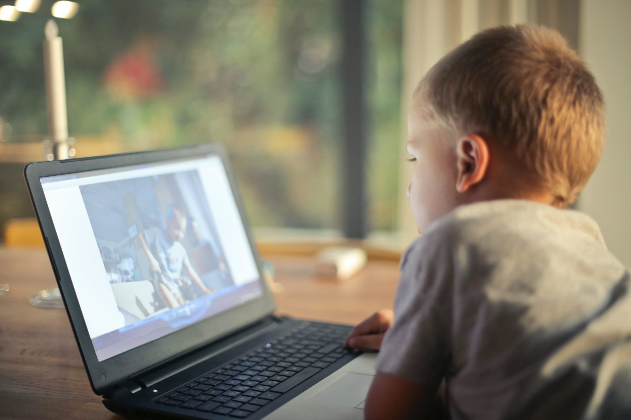 Boy looking at laptop