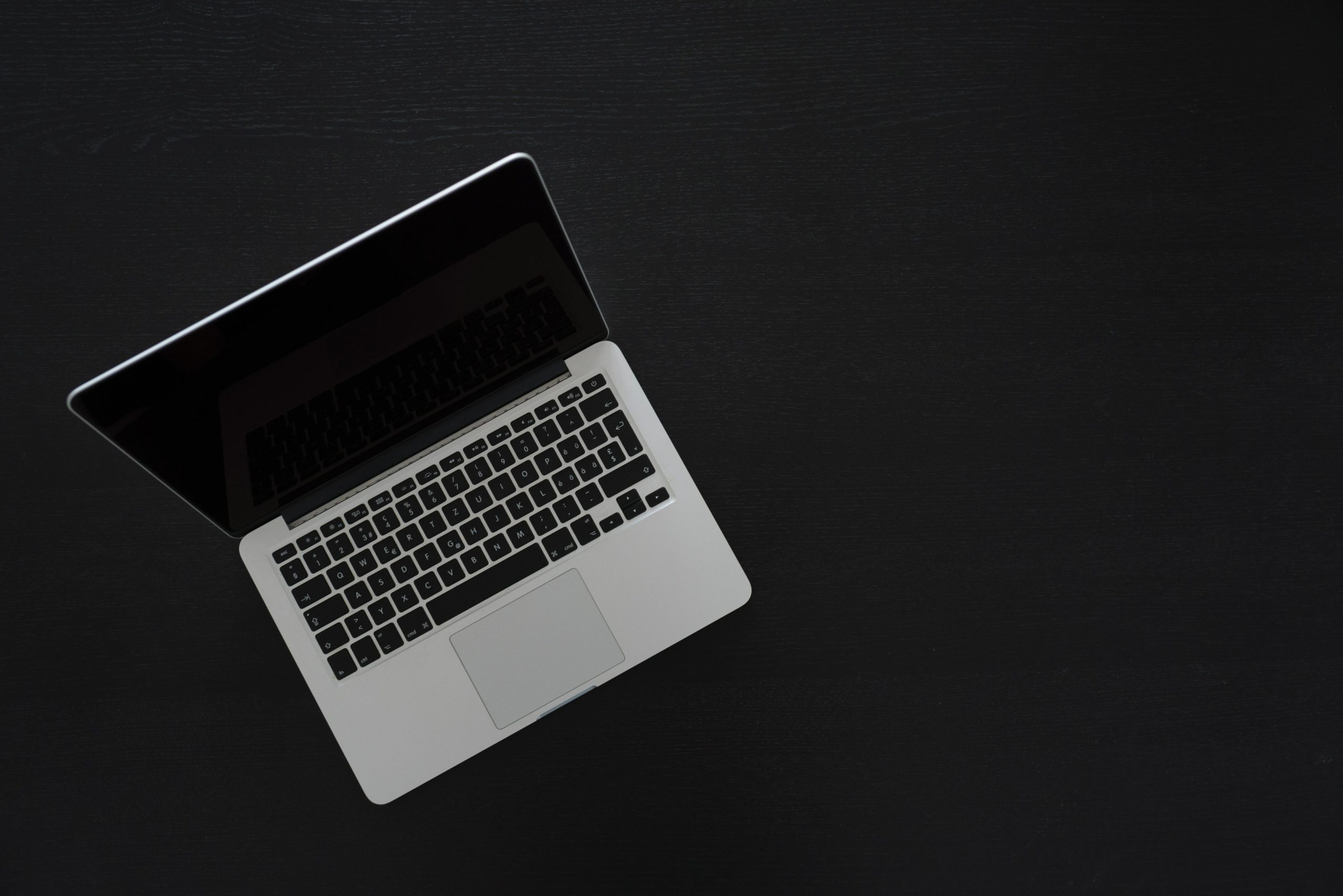 Laptop on dark floor