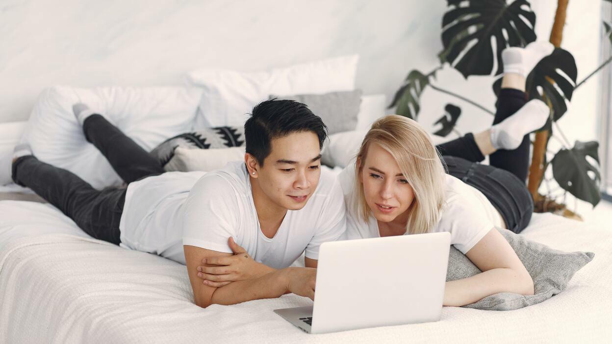Couple looking at laptop