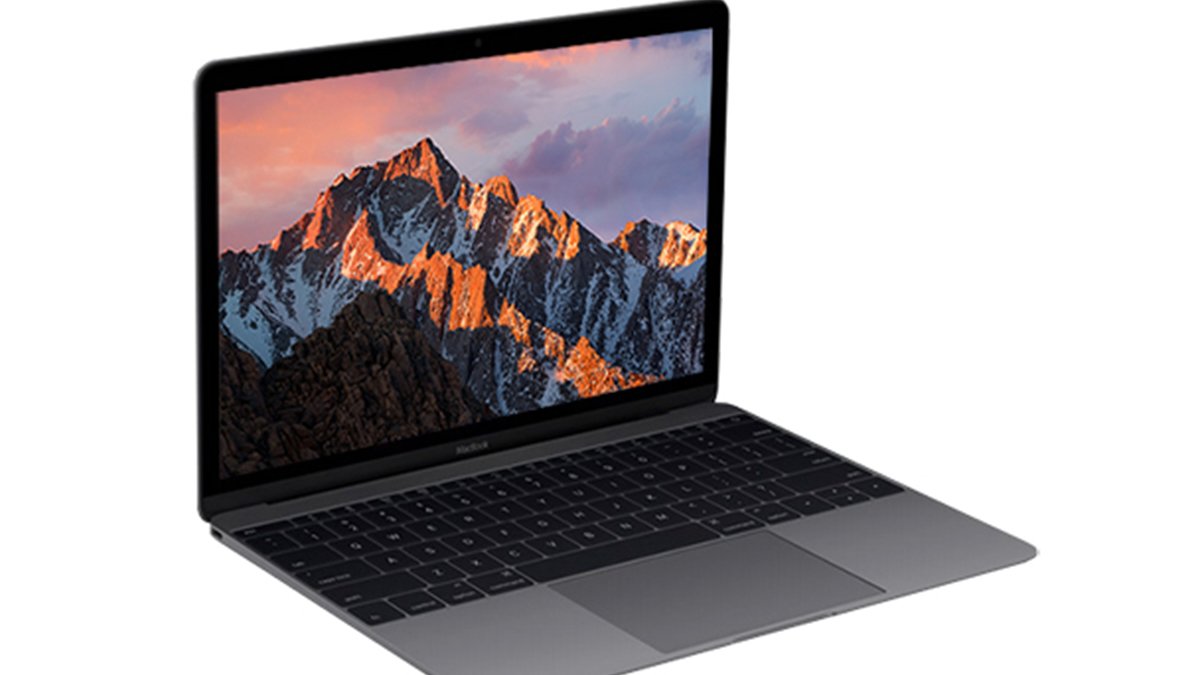 Silver macbook with mountain range background